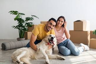 Diverse couple with a white lab | Blog | Greystar